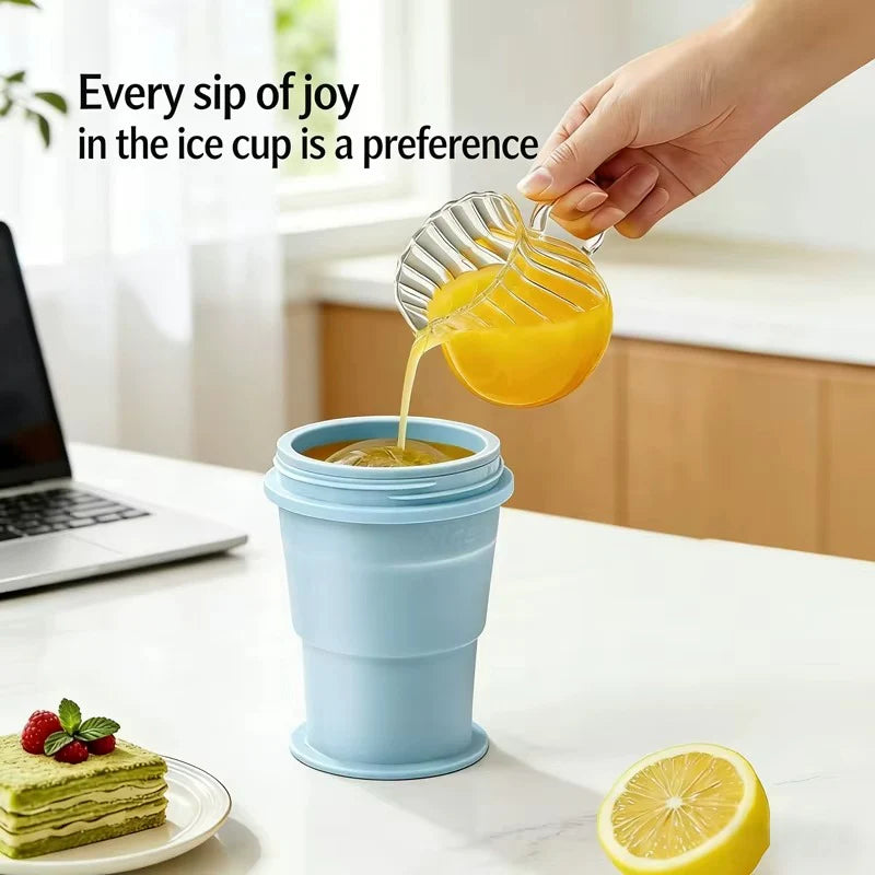 Blue collapsible ice cup with lemon ice ball and pour-over drink