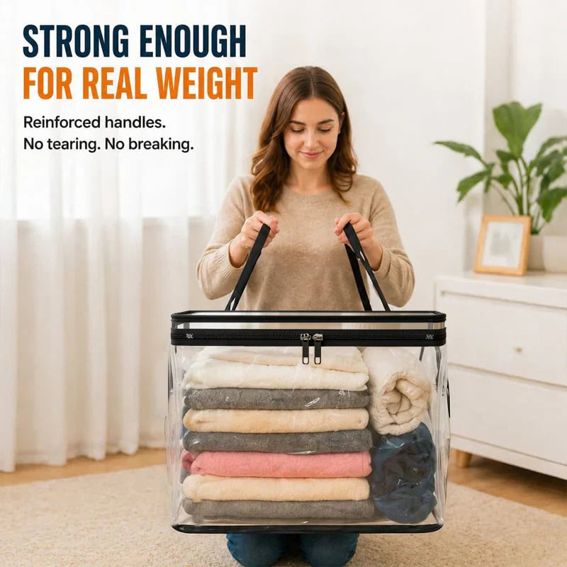 Transparent storage bin with reinforced handles, holding folded towels
