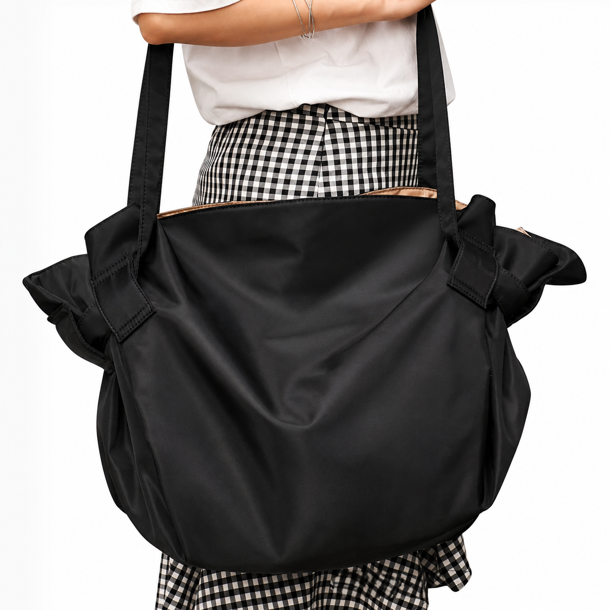 Black foldable travel organizer bag with top handles and ruched side details