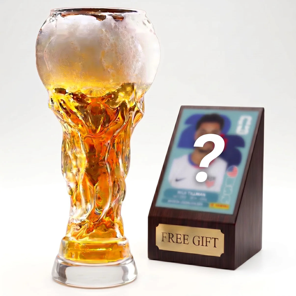Crystal trophy glass with amber drink and thick base, beside wooden gift card