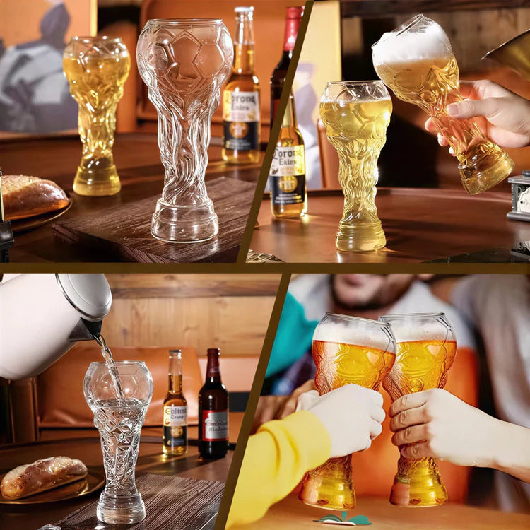 Crystal trophy glasses on table, clear and amber tinted, one held in hand