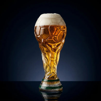 Crystal trophy glass with amber drink, gold-toned engraving on base